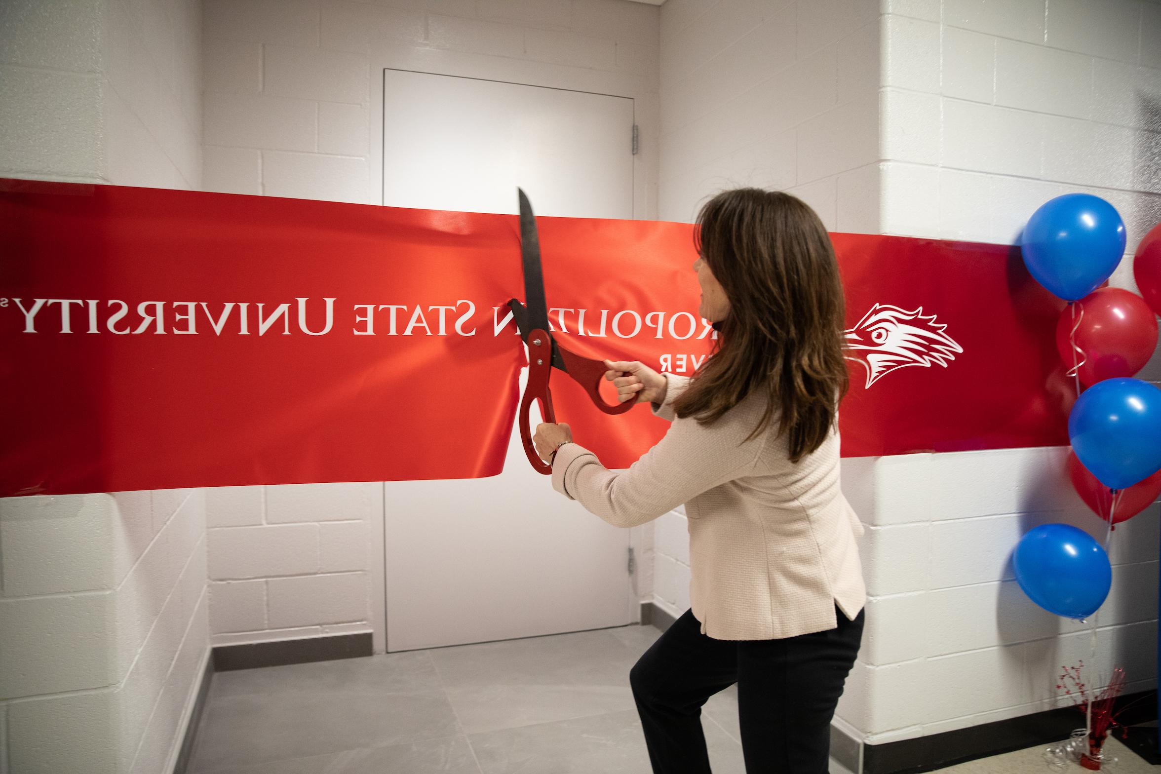 Dr. Davidson cutting the ribbon