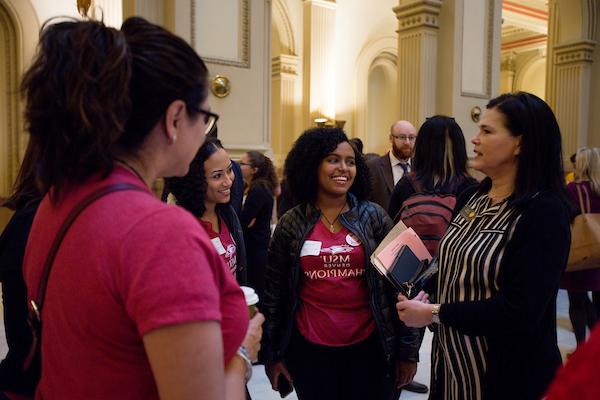 students talking at the capital