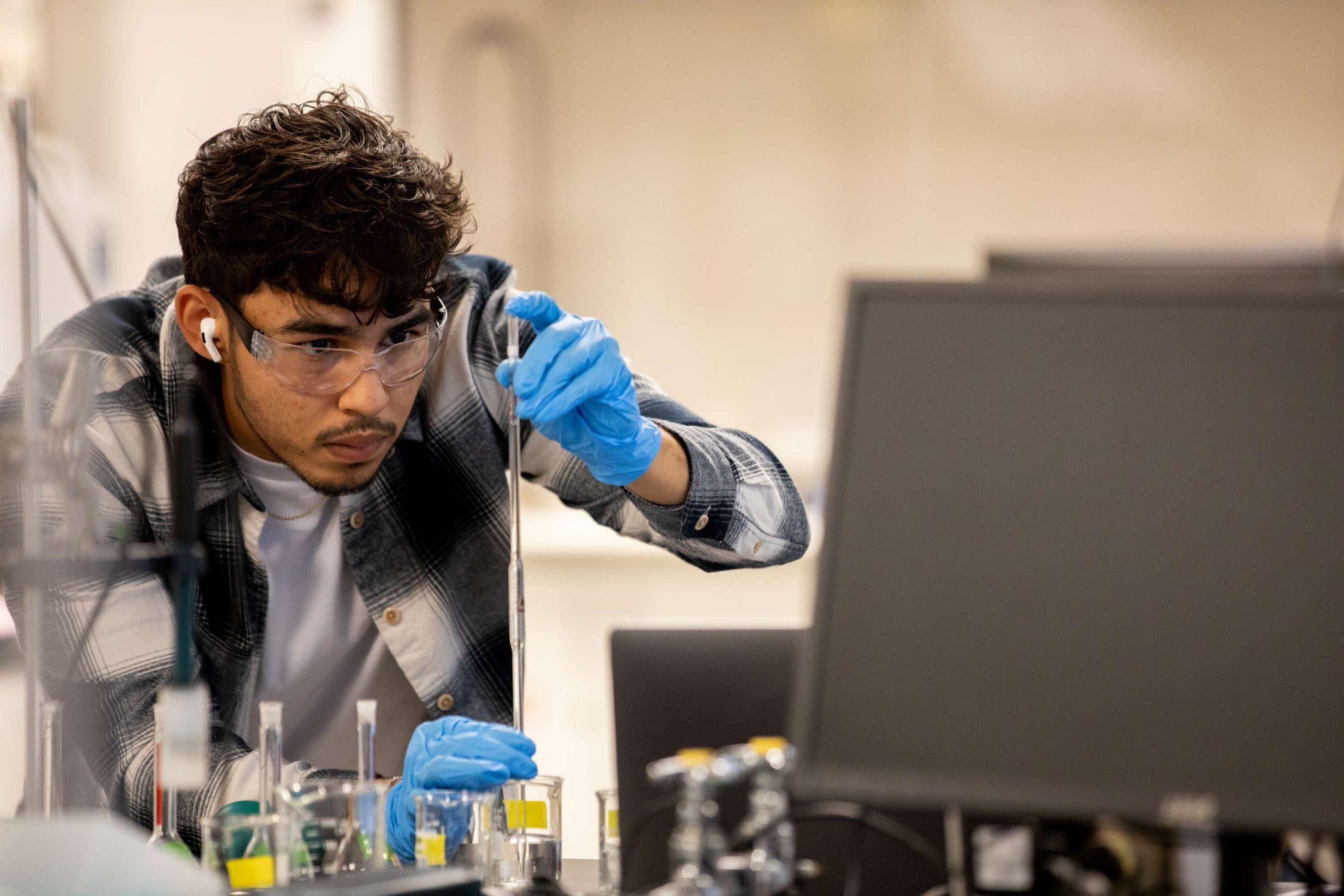 A student works in the Chemistry lab at MSU Denver